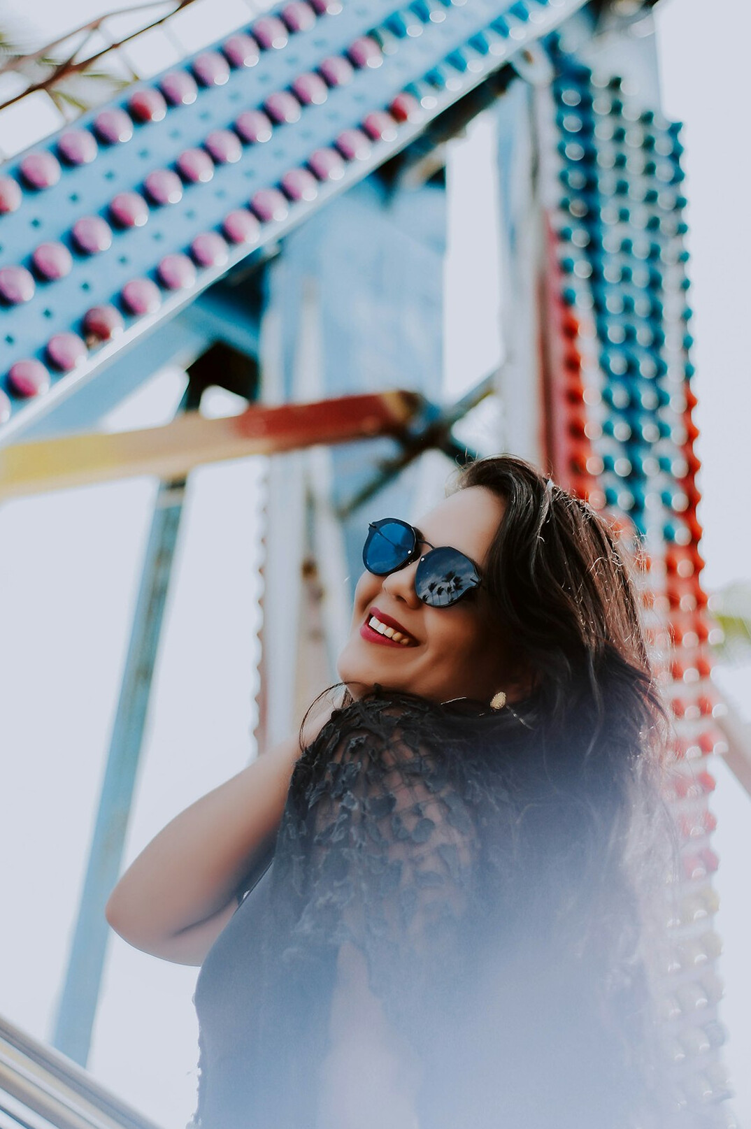 Portrait of a Brazilian woman with glasses smiling