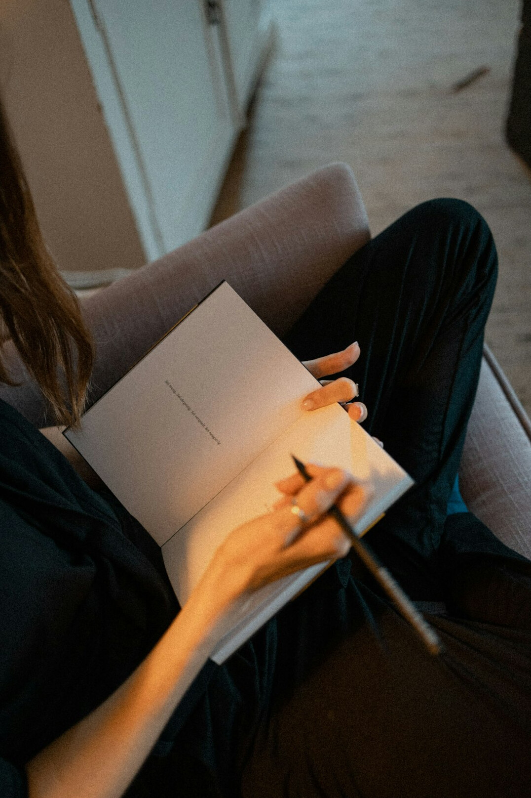 person writing journal