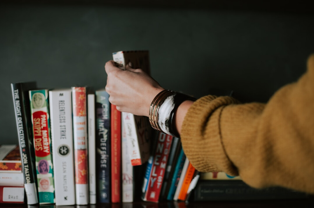 person reading self help book