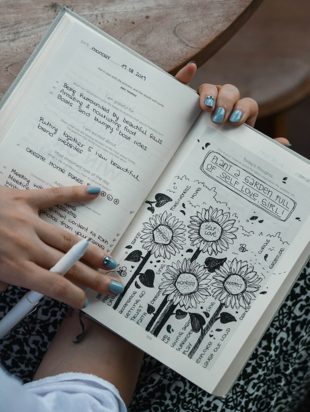 person writing in journal